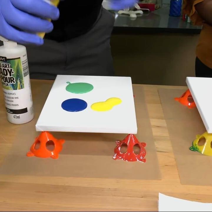 Keith Kaiser learns how to use a marble to paint at Family S.T.E.A.M. Days